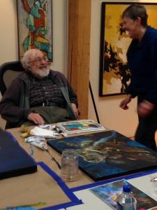 Dad and I in his studio. One of my paintings is visible on the table.